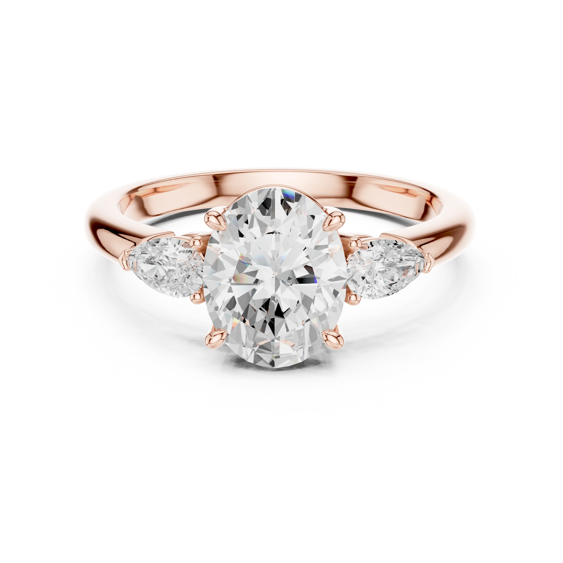 Oval three-stone ring in rose gold with pear side stones and lab-grown diamond – Australia