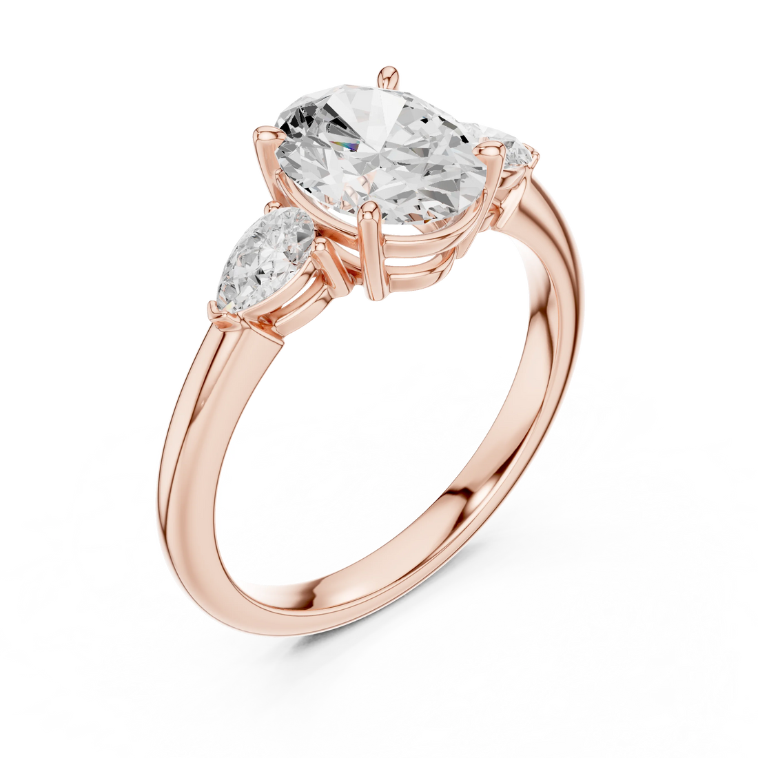 Front view of rose gold oval three-stone ring with pear side stones and lab-grown diamond – Australia