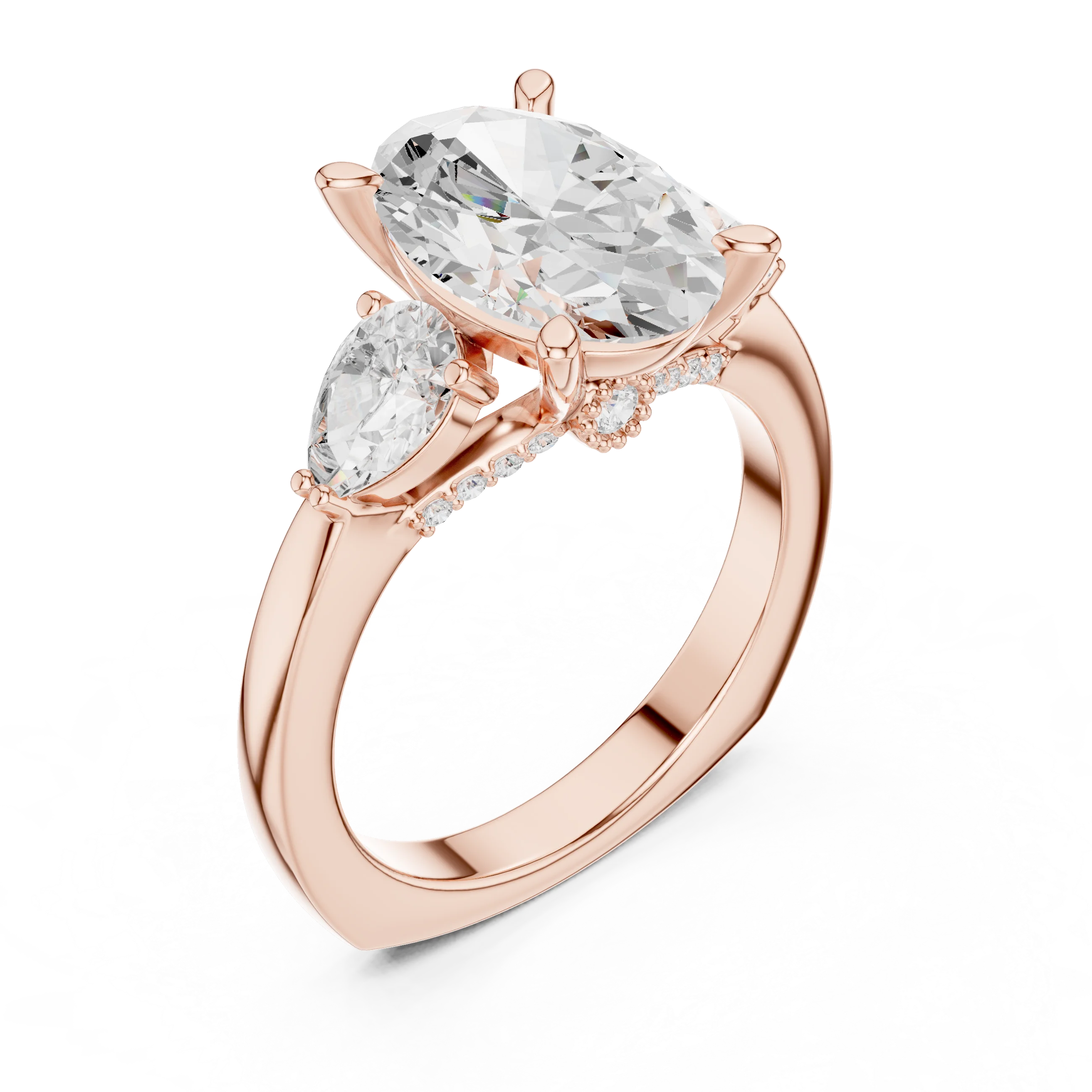 Front view of rose gold oval three stone ring with pear side stones and lab-grown diamonds

