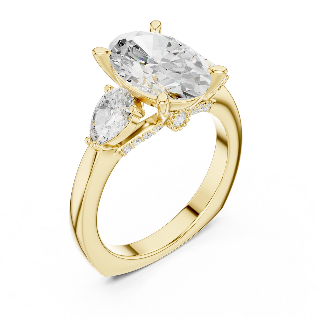 Front view of yellow gold oval three stone ring with pear side stones and lab-grown diamonds