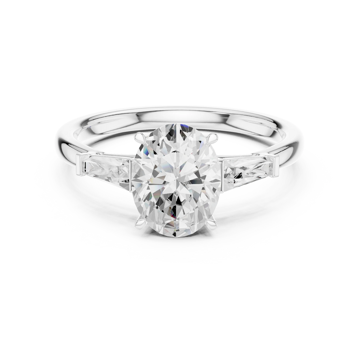 Oval three stone ring with tapered baguette side stones and lab-grown diamonds in white gold, elegant and timeless design, Australia collection