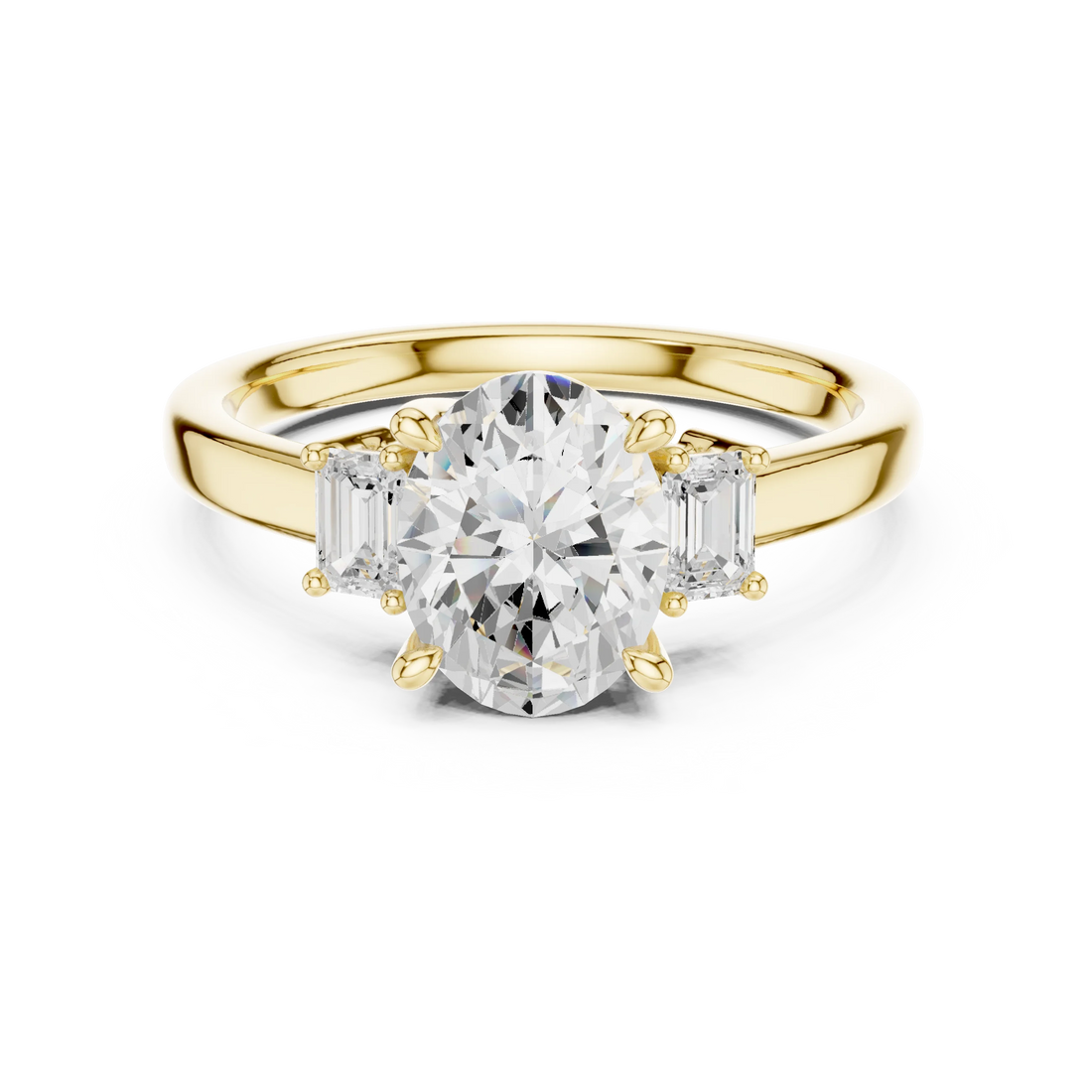 Lab-grown oval cut three stone diamond ring in yellow gold, classic top view.