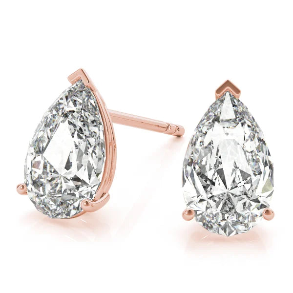 Pair of pear-shaped diamond earrings with rose gold prongs on a white background with Front view