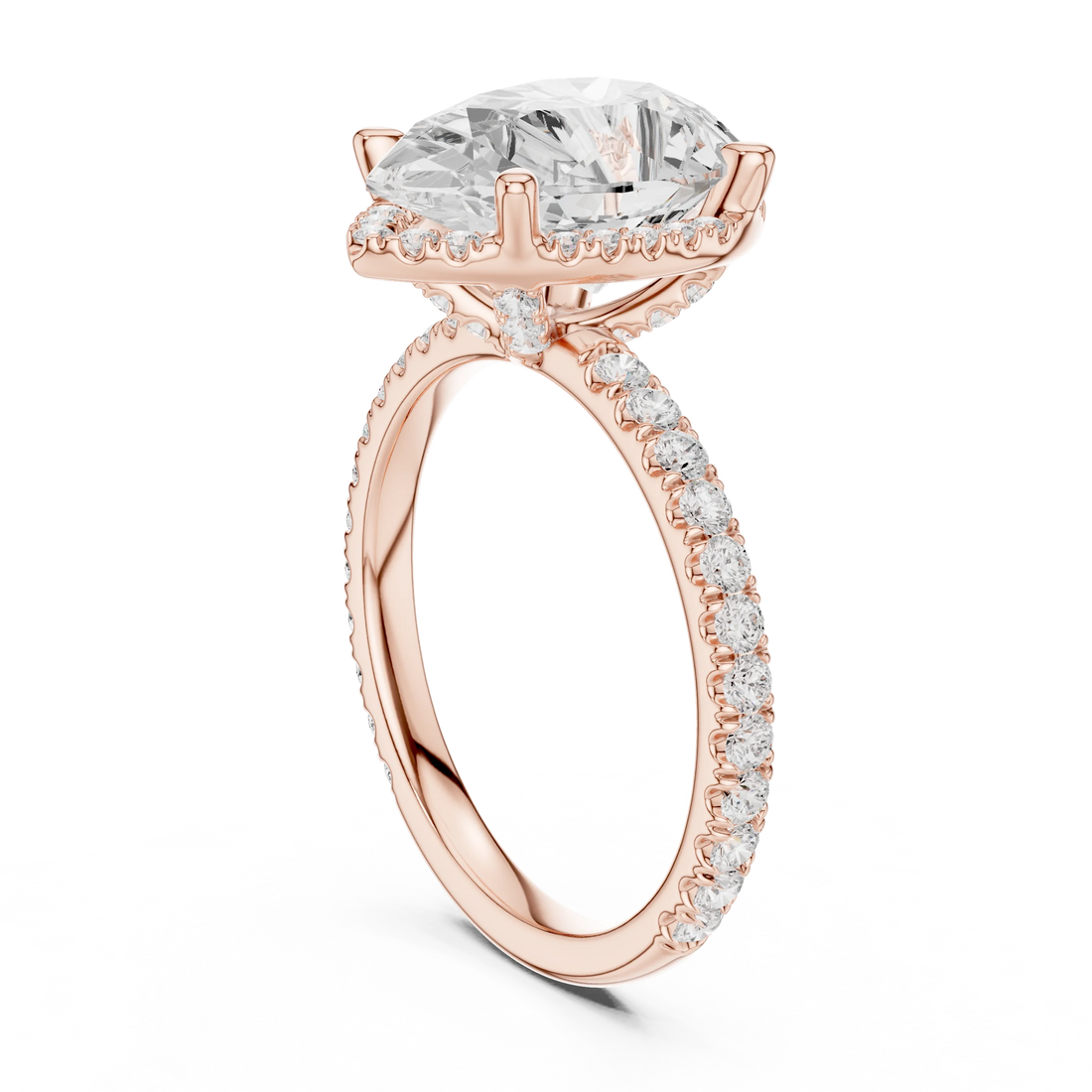 Back side view of rose gold pear cut solitaire ring showing hidden halo and thin pavé band structure