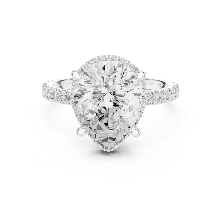 White gold pear cut solitaire ring with hidden halo and thin pavé band featuring lab-grown diamond, delicate design