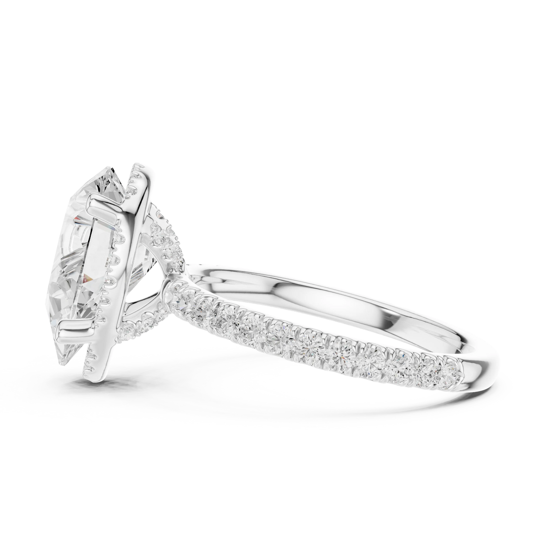 Side view of white gold pear cut solitaire ring highlighting hidden halo and thin pavé band design