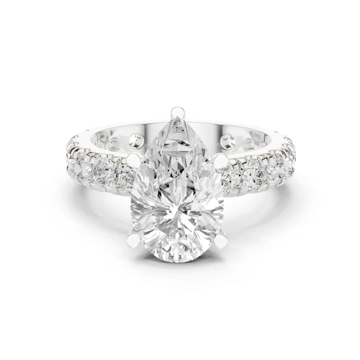 White gold pear cut solitaire ring with pave band and lab-grown diamond, elegant design