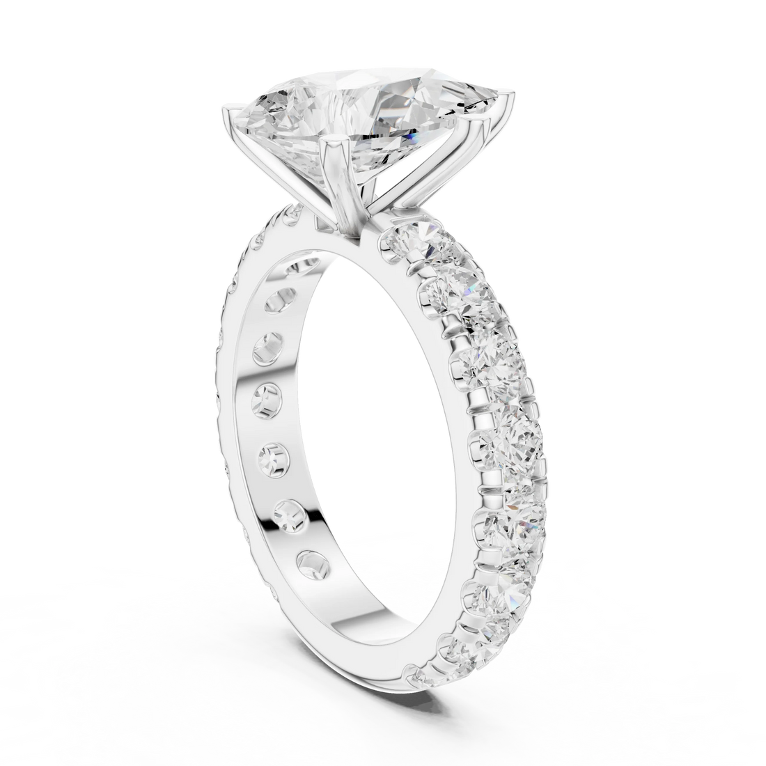 Back side view of white gold pear cut solitaire ring showing pave band and setting details