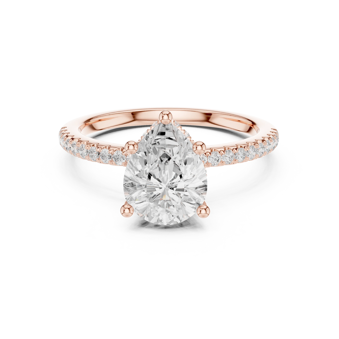 Rose gold pear cut solitaire ring with thin pave band and lab-grown diamond, modern delicate look