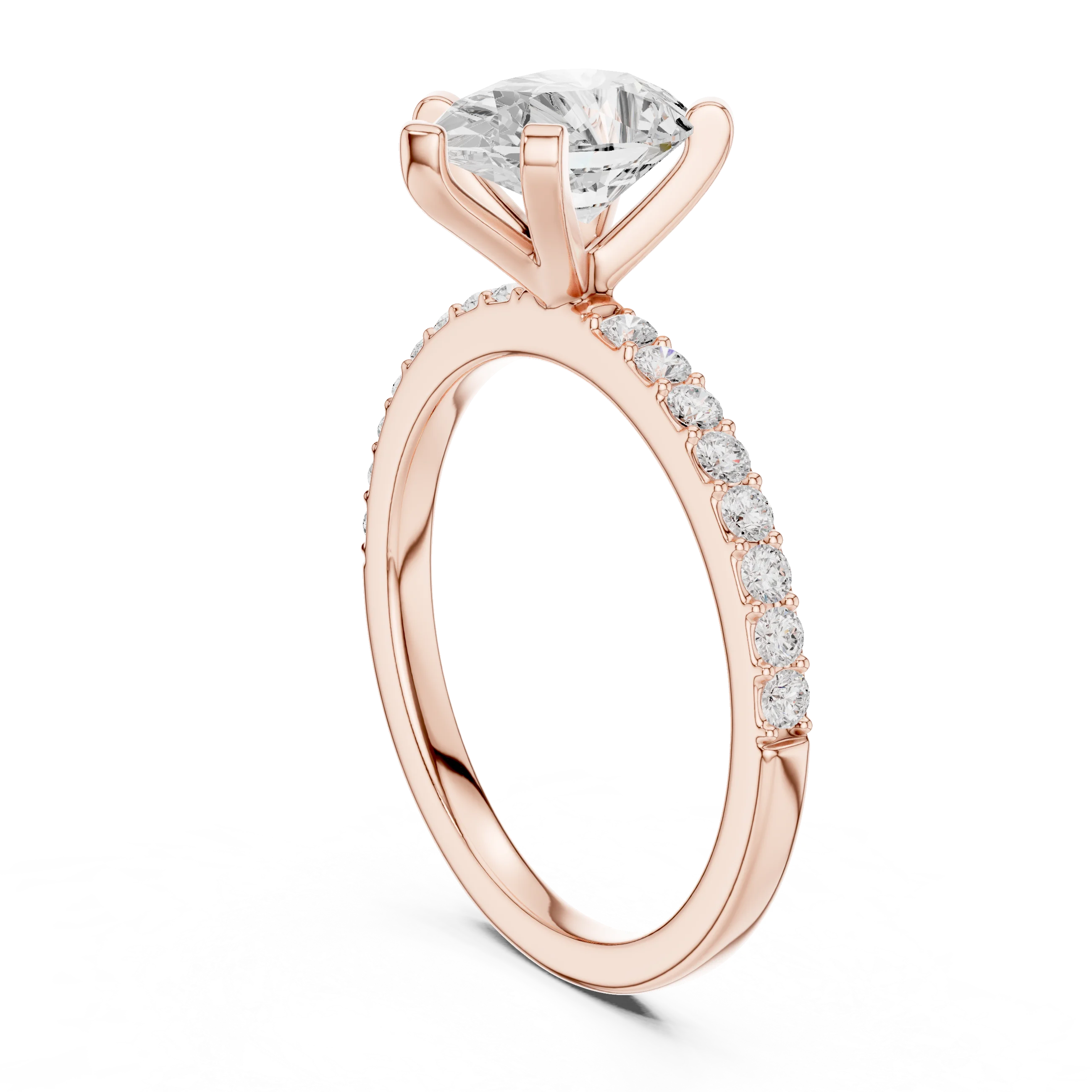 Back side view of rose gold pear solitaire ring showing thin pavé band and setting details