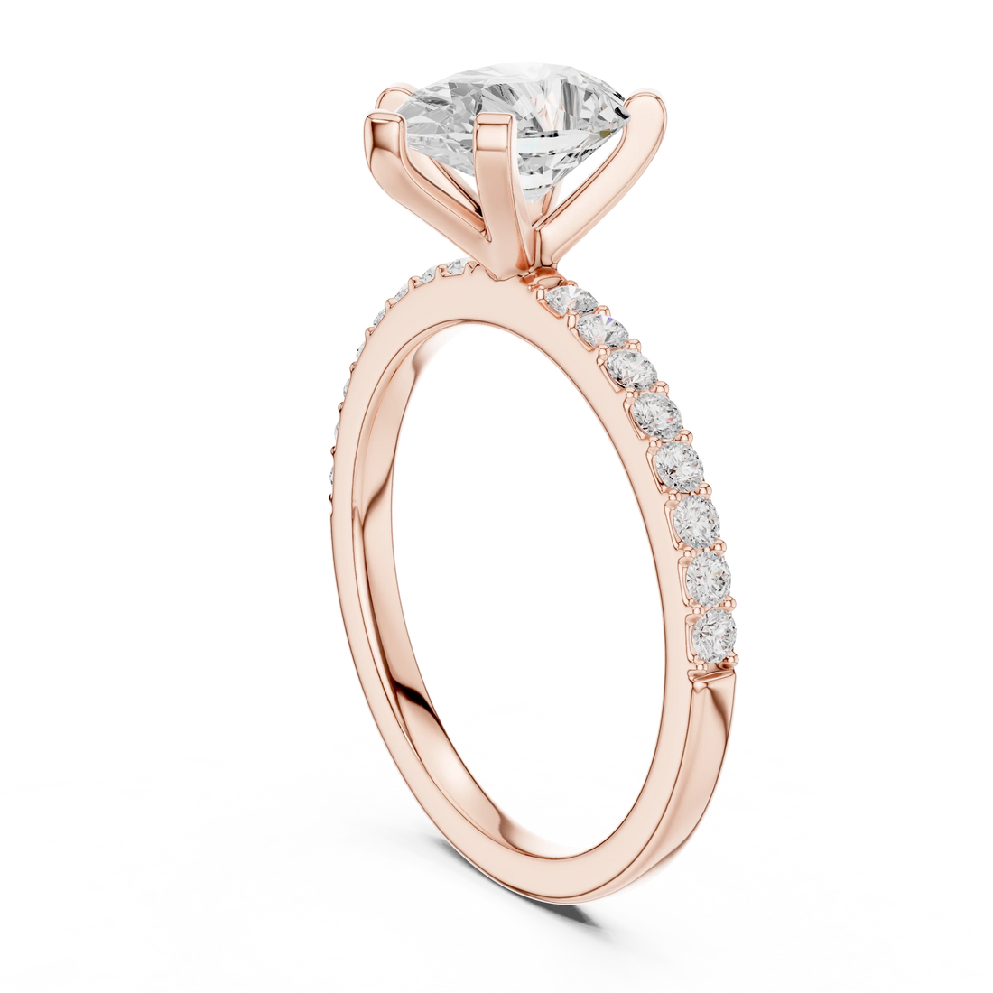 Back side view of rose gold pear solitaire ring showing thin pavé band and setting details