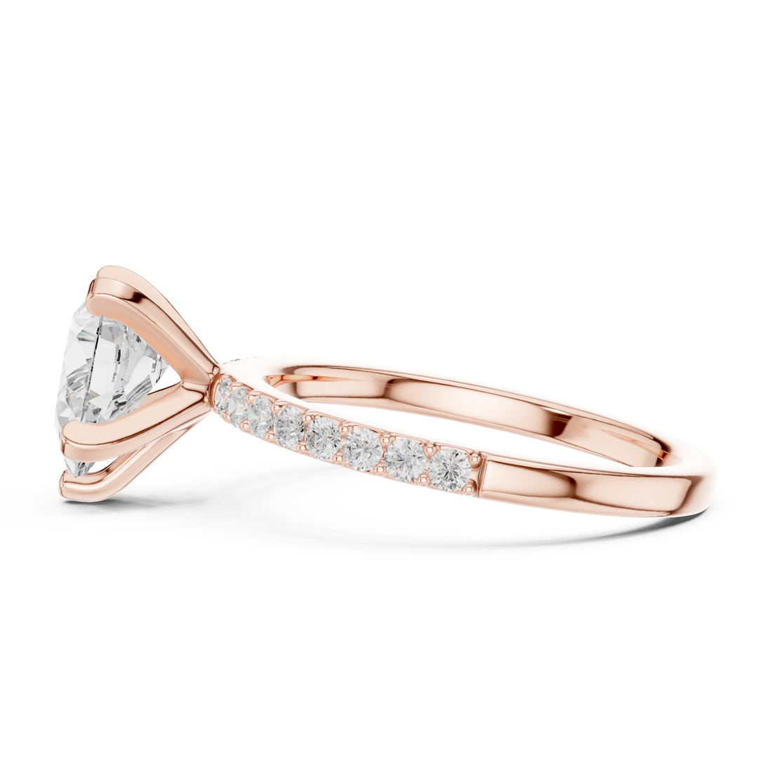 Side profile of rose gold pear solitaire ring with thin pavé band and elevated setting