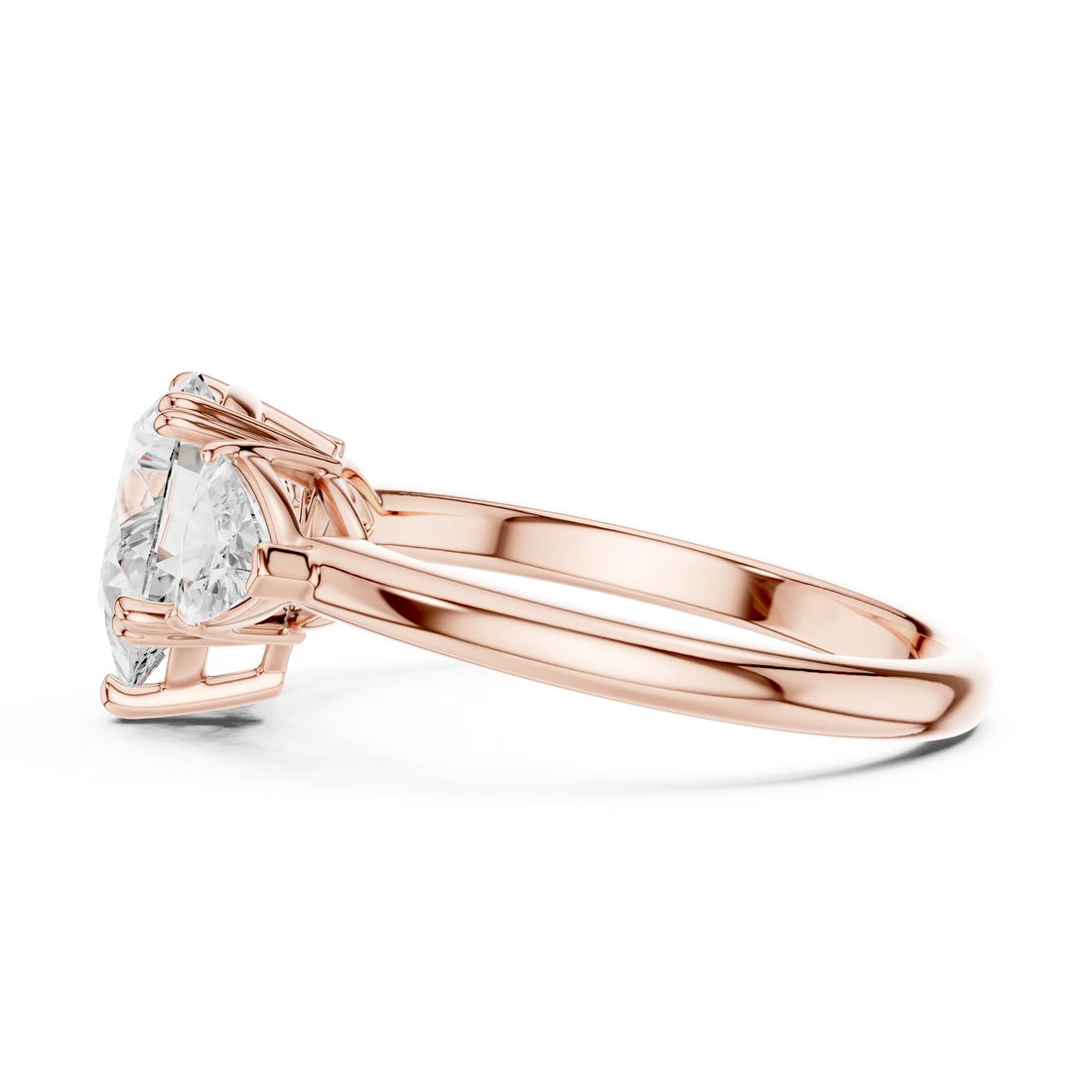 Side view of rose gold pear three-stone ring with trillion cut side stones and lab-grown diamond – Australia
