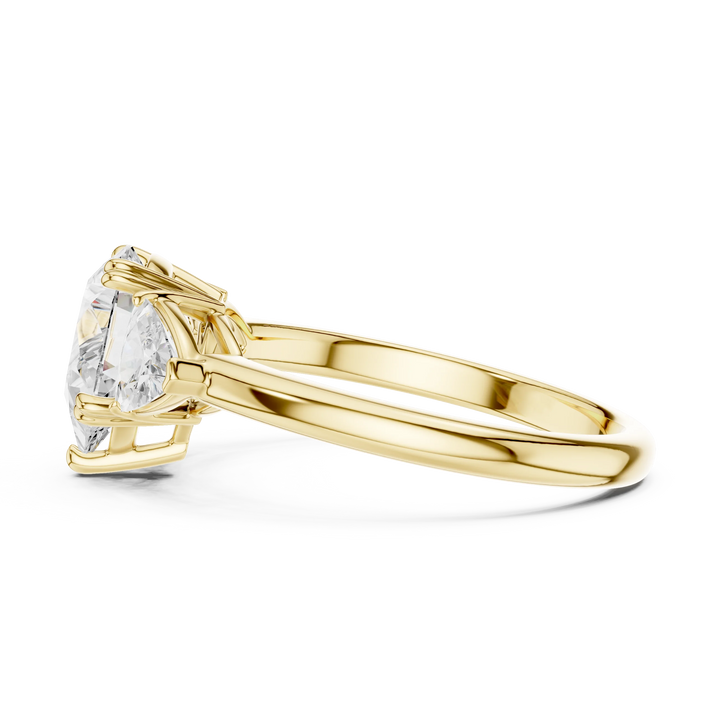 Pear three-stone ring in yellow gold with trillion cut side stones and lab-grown diamond – Australia