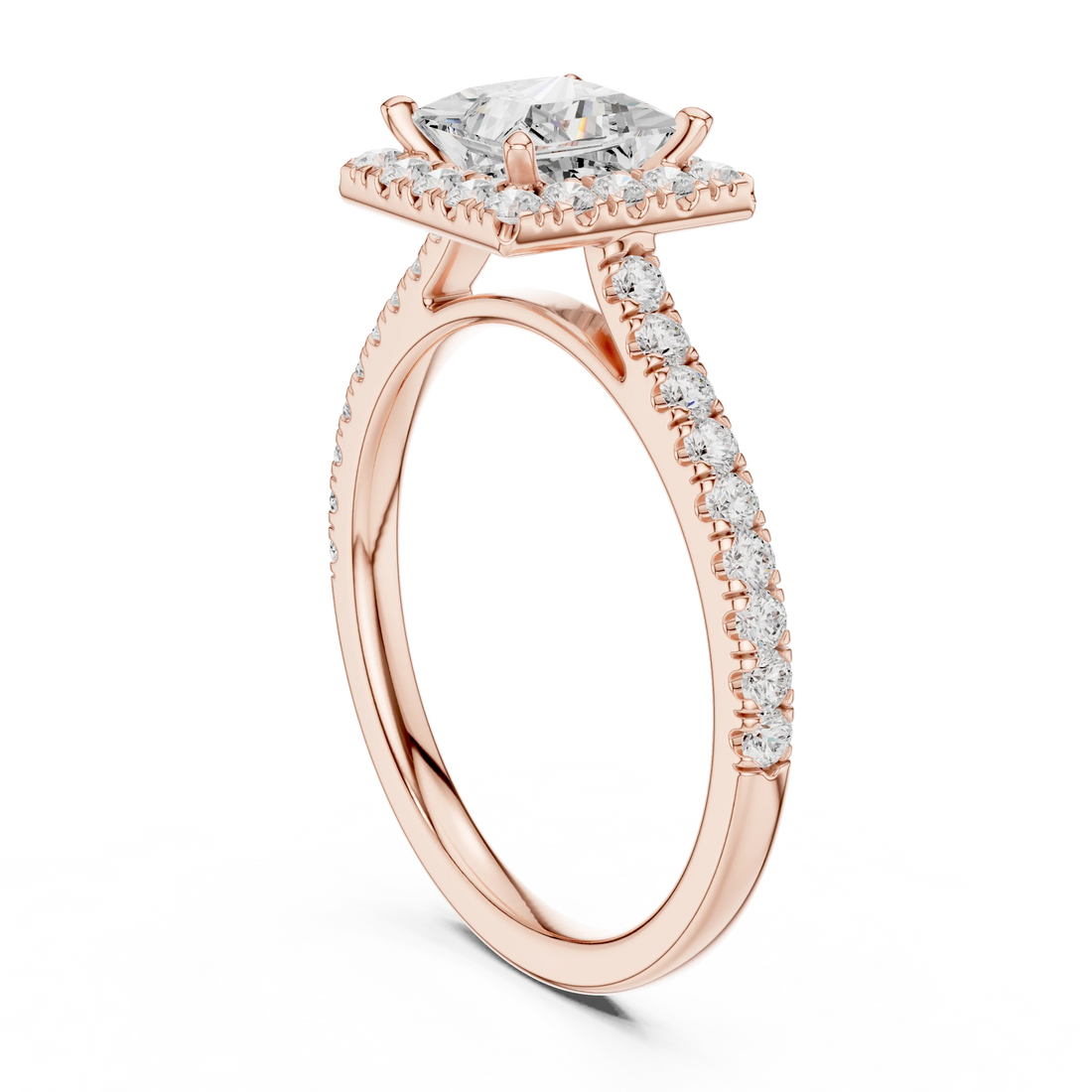 Top view of a rose gold princess halo ring with a pavé diamond band and lab-grown center stone