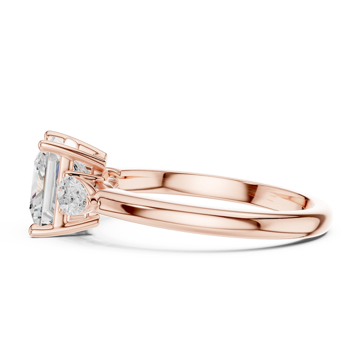 Side view of rose gold princess three-stone ring with pear side stones and lab-grown diamond – Australia
