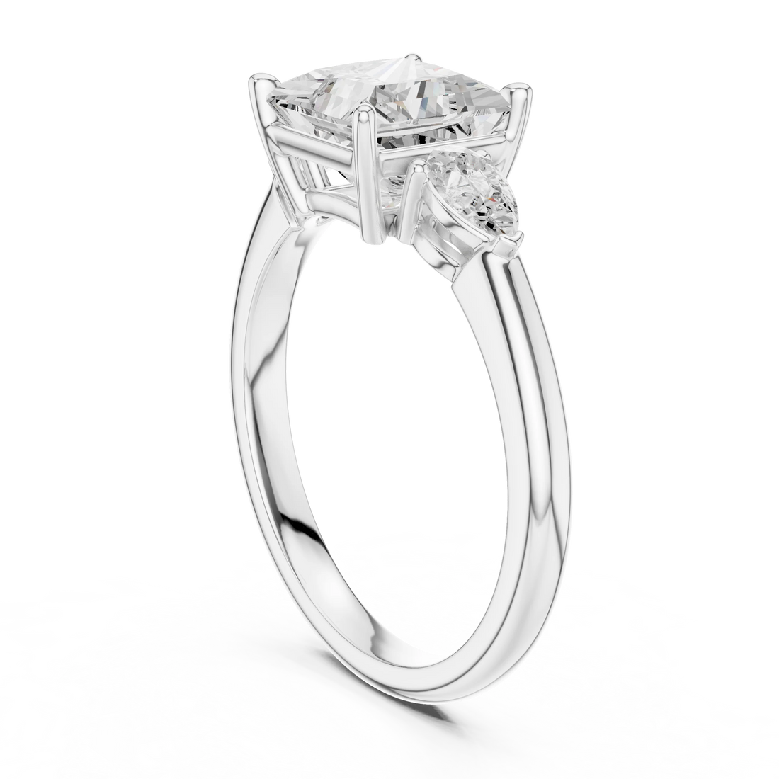 Back side view of white gold princess three-stone ring with pear side stones and lab-grown diamond – Australia