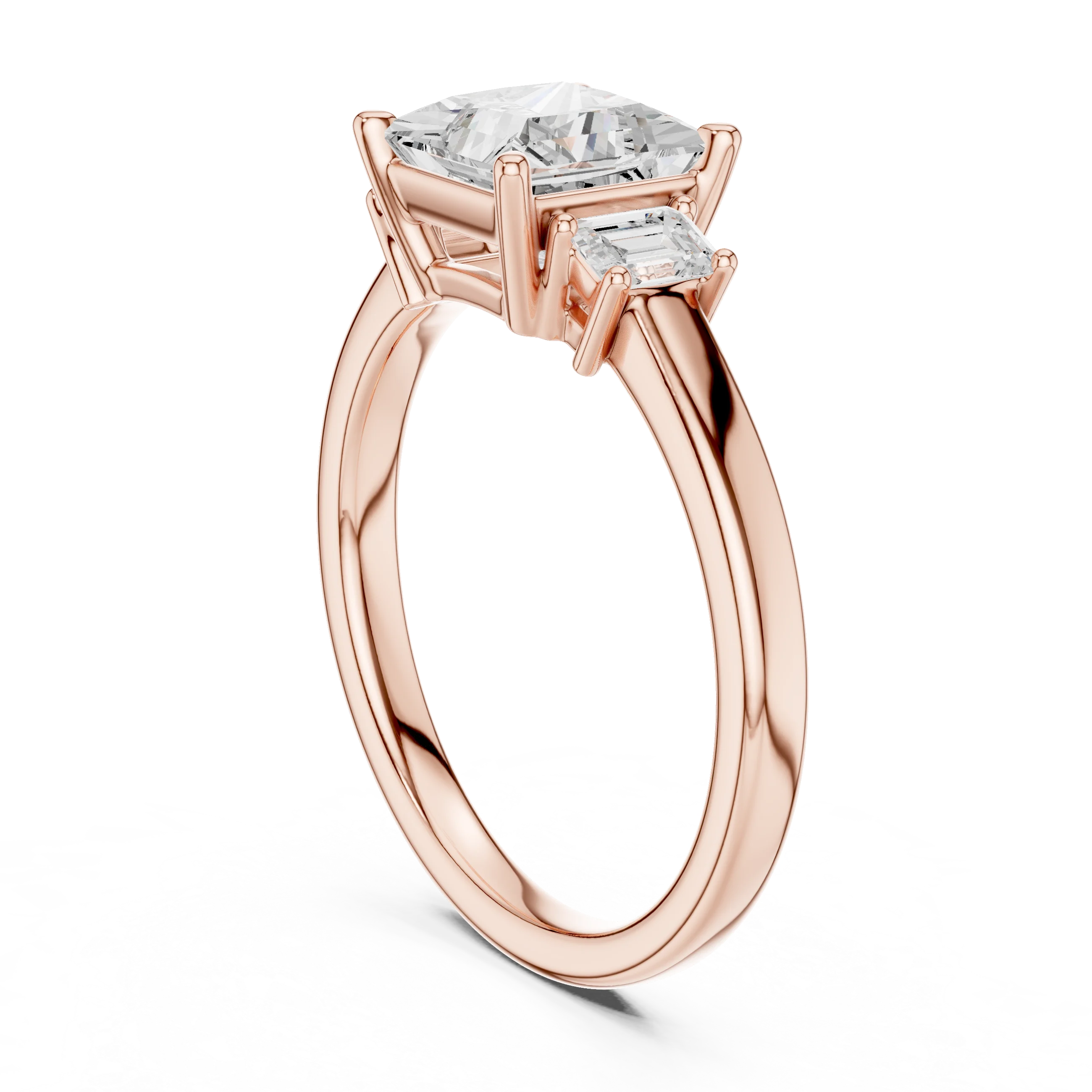 Back side view of rose gold princess three stone diamond ring, detailing band and setting.