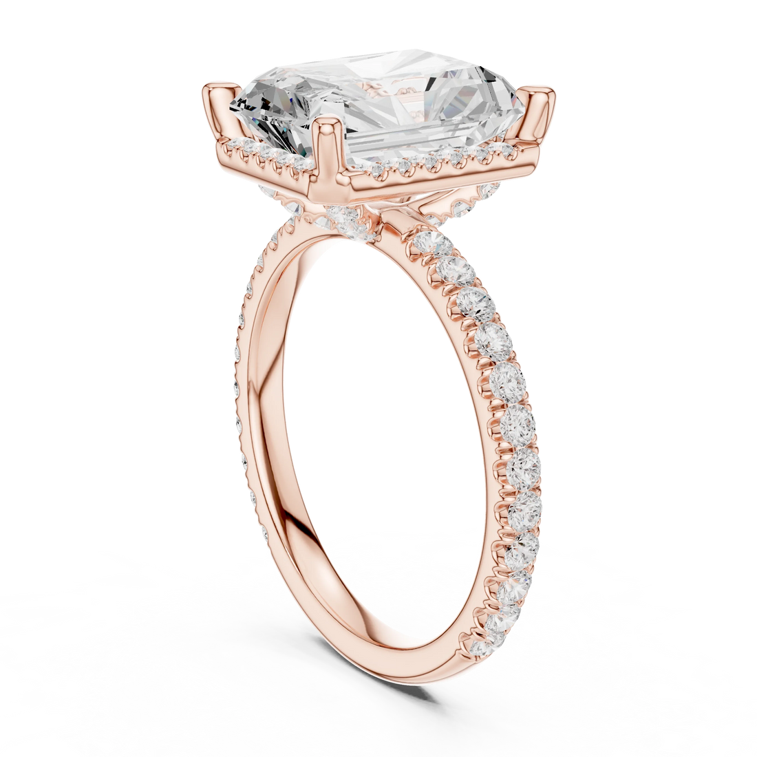 Back view of rose gold radiant cut micro halo ring showing pavé diamond band and halo setting details