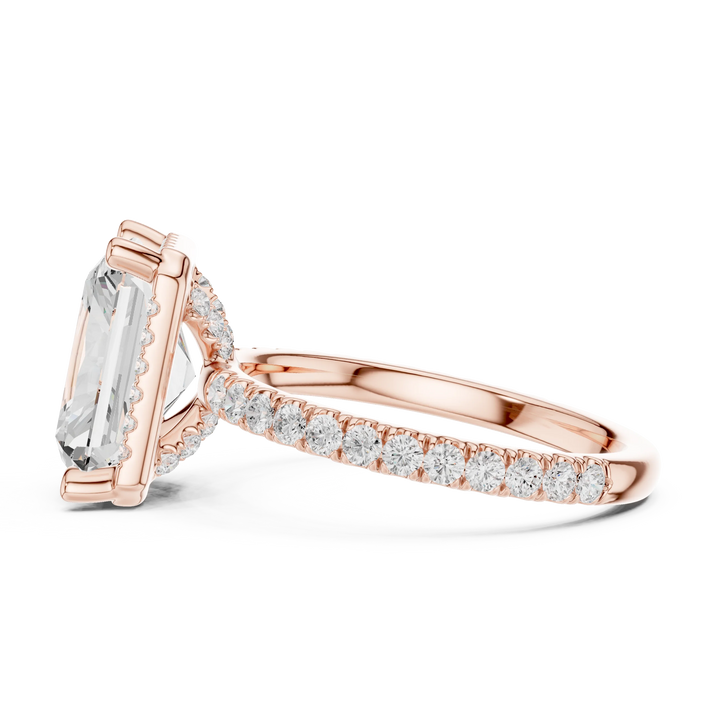 Side view of rose gold radiant cut micro halo ring highlighting pavé diamond band and halo profile
