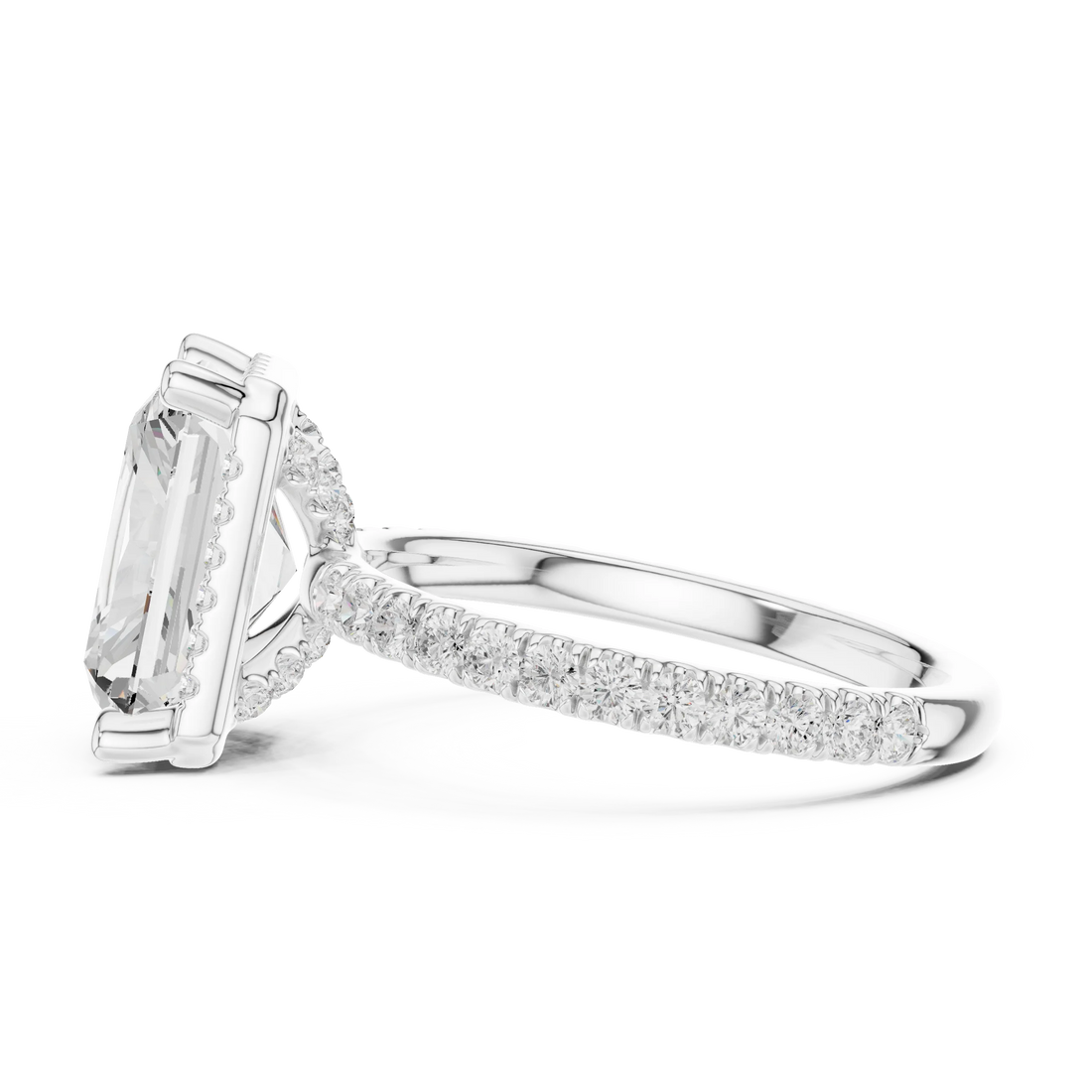Side view of white gold radiant cut micro halo ring highlighting pavé diamond band and halo profile