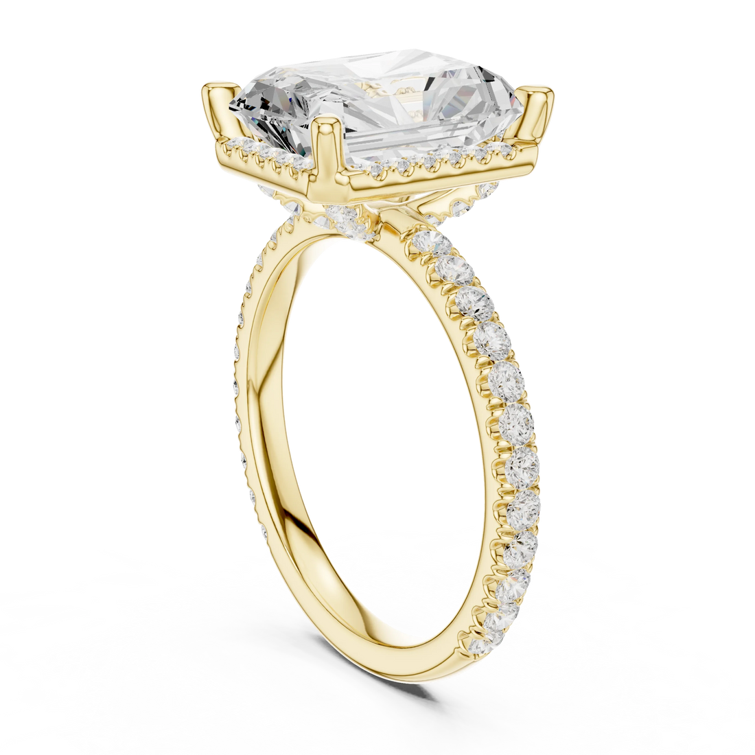 Back view of yellow gold radiant cut micro halo ring showing pavé diamond band and halo setting details