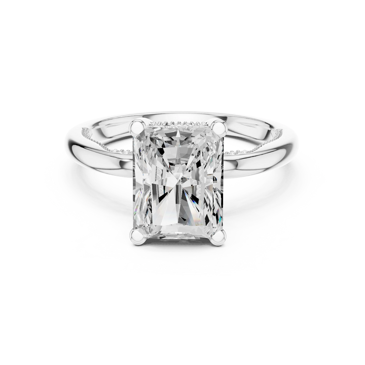 White gold radiant cut solitaire ring with hidden halo and domed band featuring lab-grown diamond, elegant design