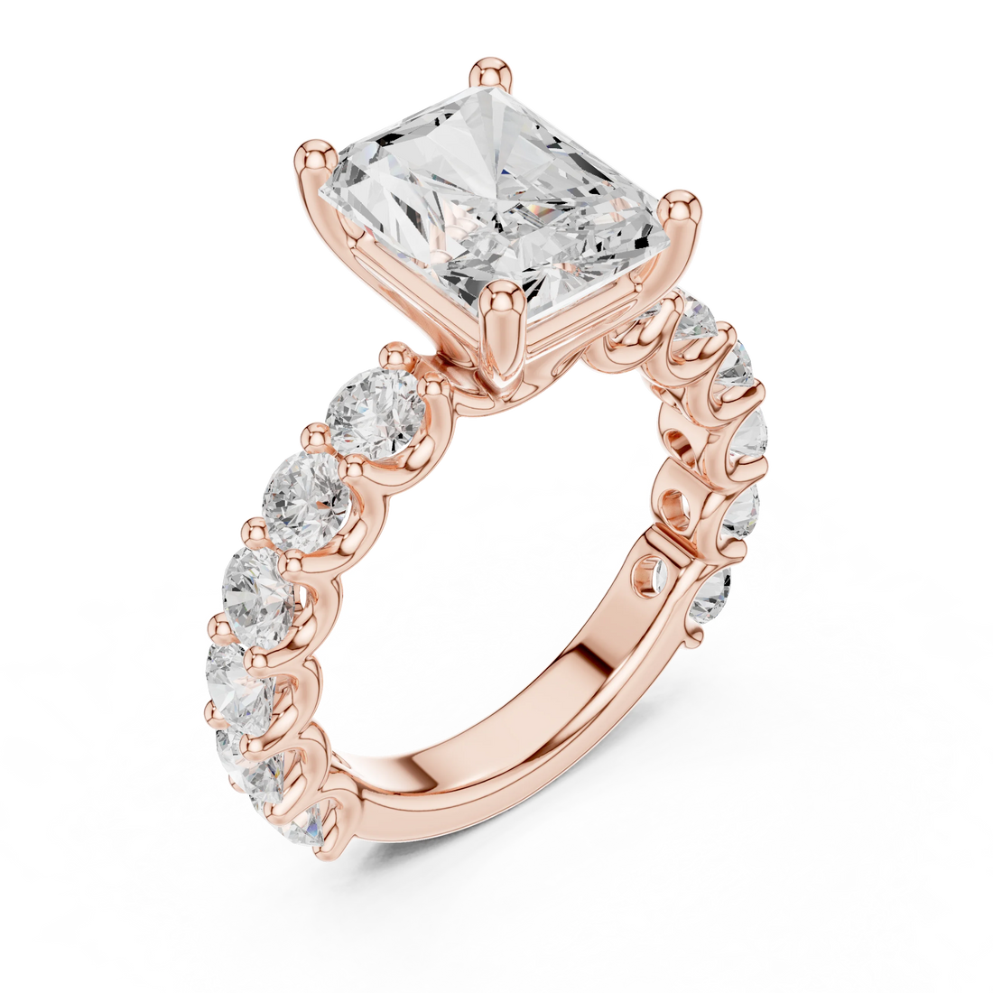 Front side view of rose gold radiant cut solitaire ring with shared prong large stone band and setting details