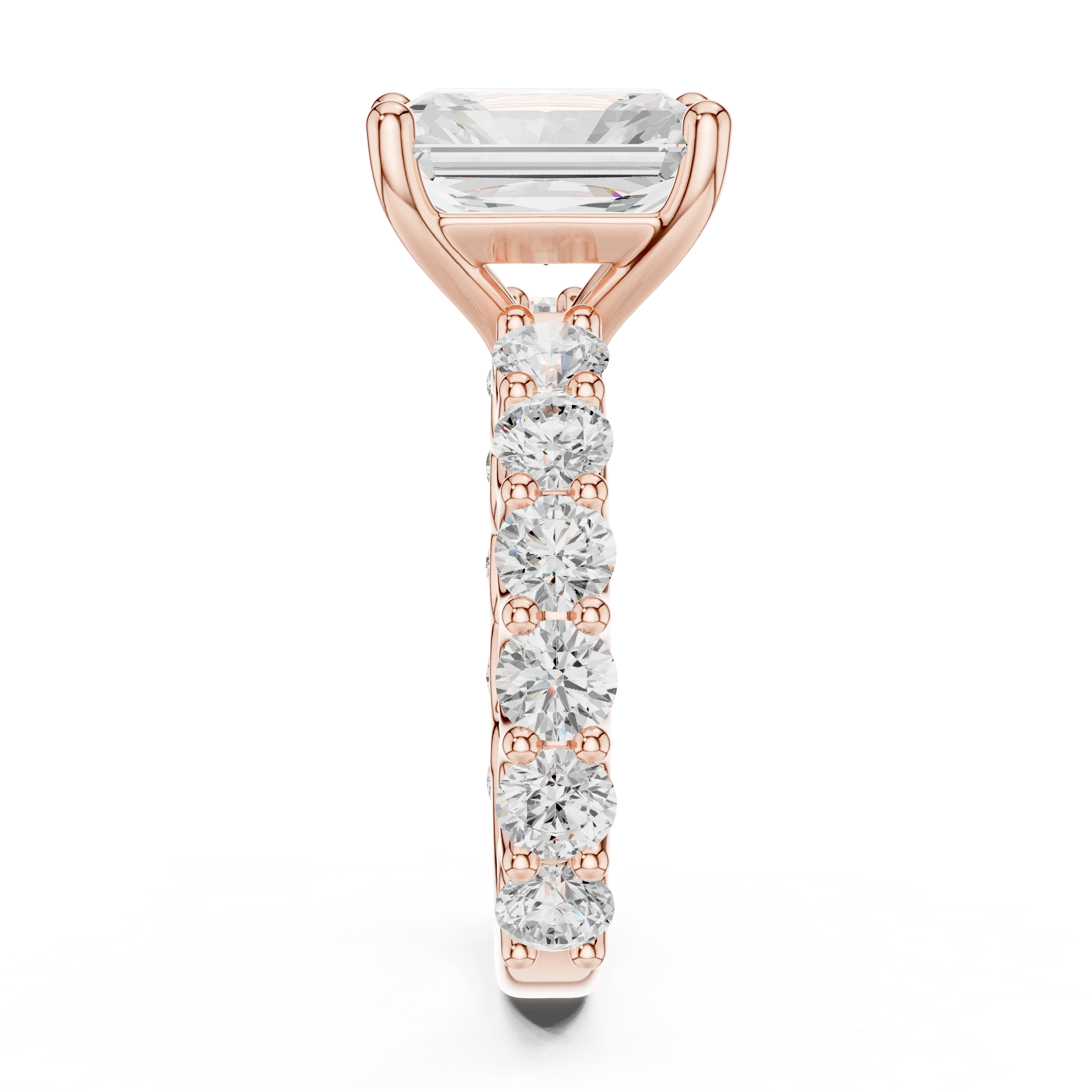 Side profile of rose gold radiant cut solitaire ring with shared prong large stone band and elevated center stone