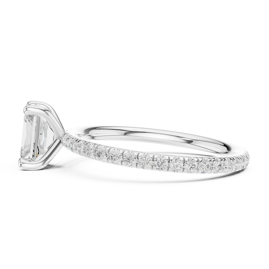 Side view of white gold radiant cut solitaire ring with thin pavé diamond band and raised setting