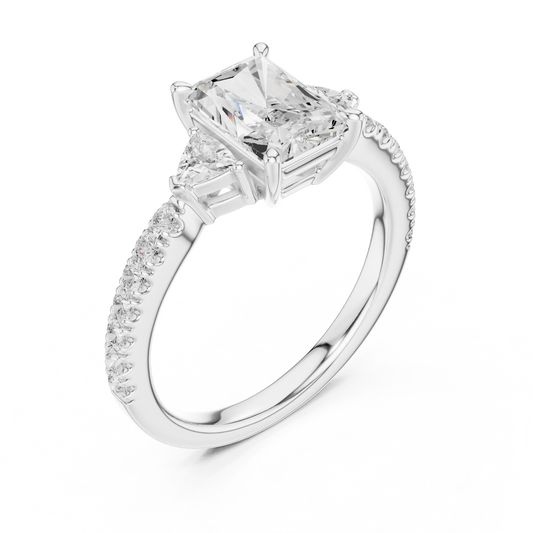 Front view of white gold radiant three stone diamond ring with half moon side stones and pave band, showcasing center stone.