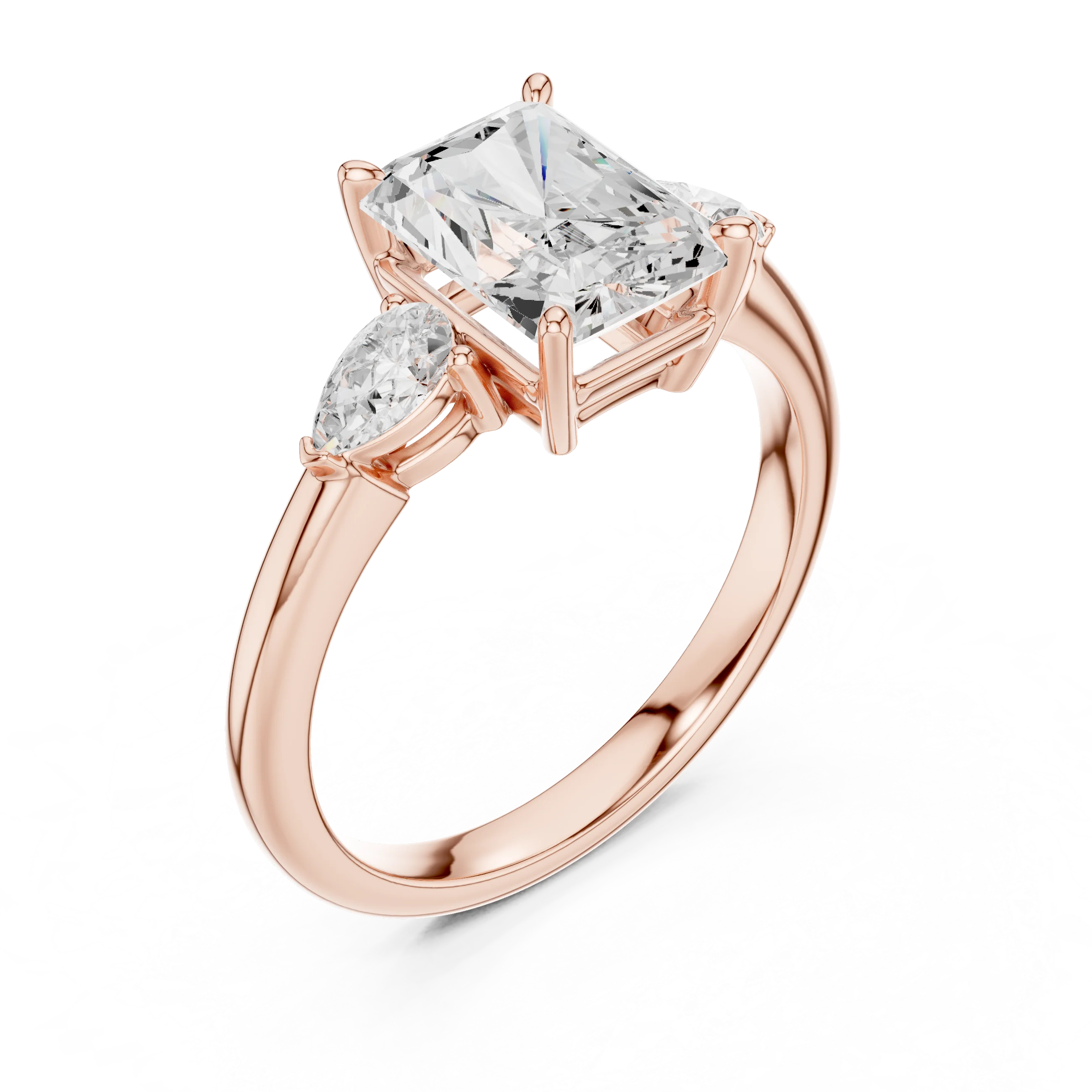 Front view of rose gold radiant three-stone ring with pear side stones and lab-grown diamond – Australia