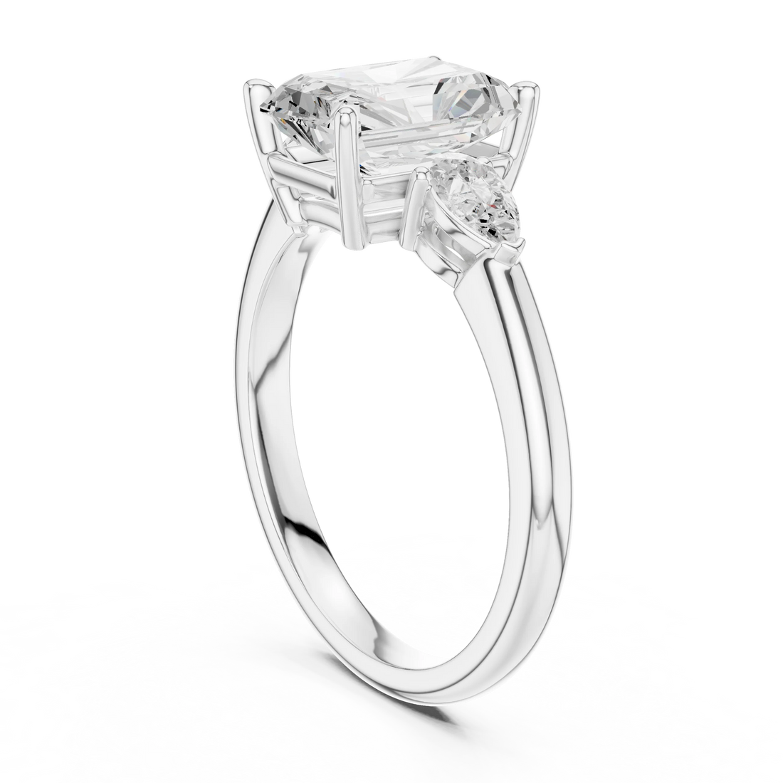 Back side view of white gold radiant three-stone ring with pear side stones and lab-grown diamond – Australia