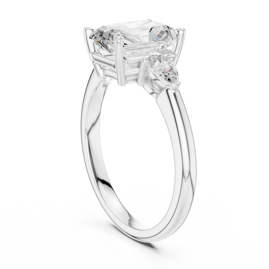 Back side view of white gold radiant three-stone ring with pear side stones and lab-grown diamond – Australia