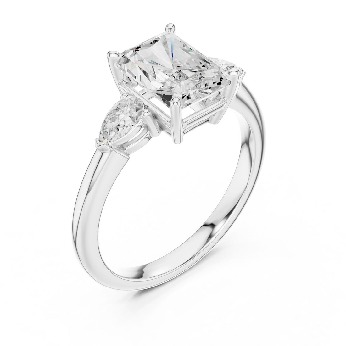 Front view of white gold radiant three-stone ring with pear side stones and lab-grown diamond – Australia