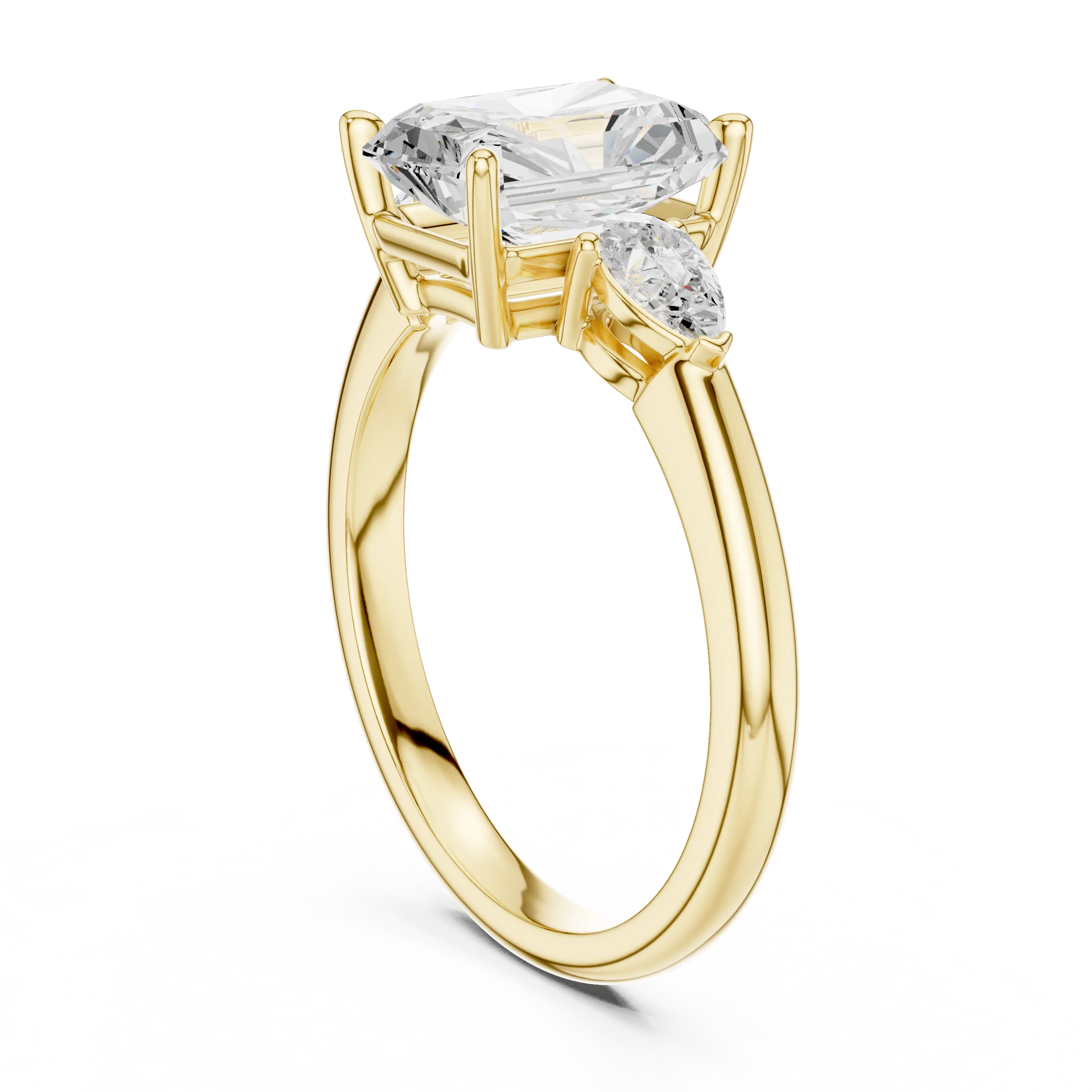Back side view of yellow gold radiant three-stone ring with pear side stones and lab-grown diamond – Australia