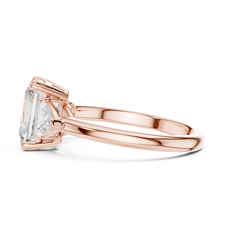 Side view of rose gold radiant three-stone ring with trillion cut side stones and lab-grown diamond – Australia