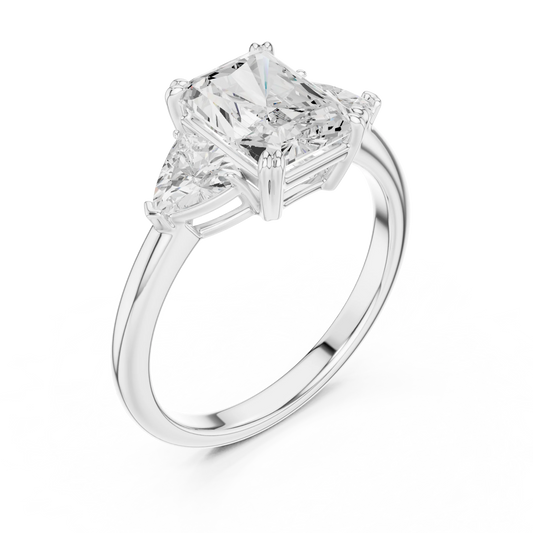 Front view of white gold radiant three-stone ring with trillion cut side stones and lab-grown diamond – Australia
