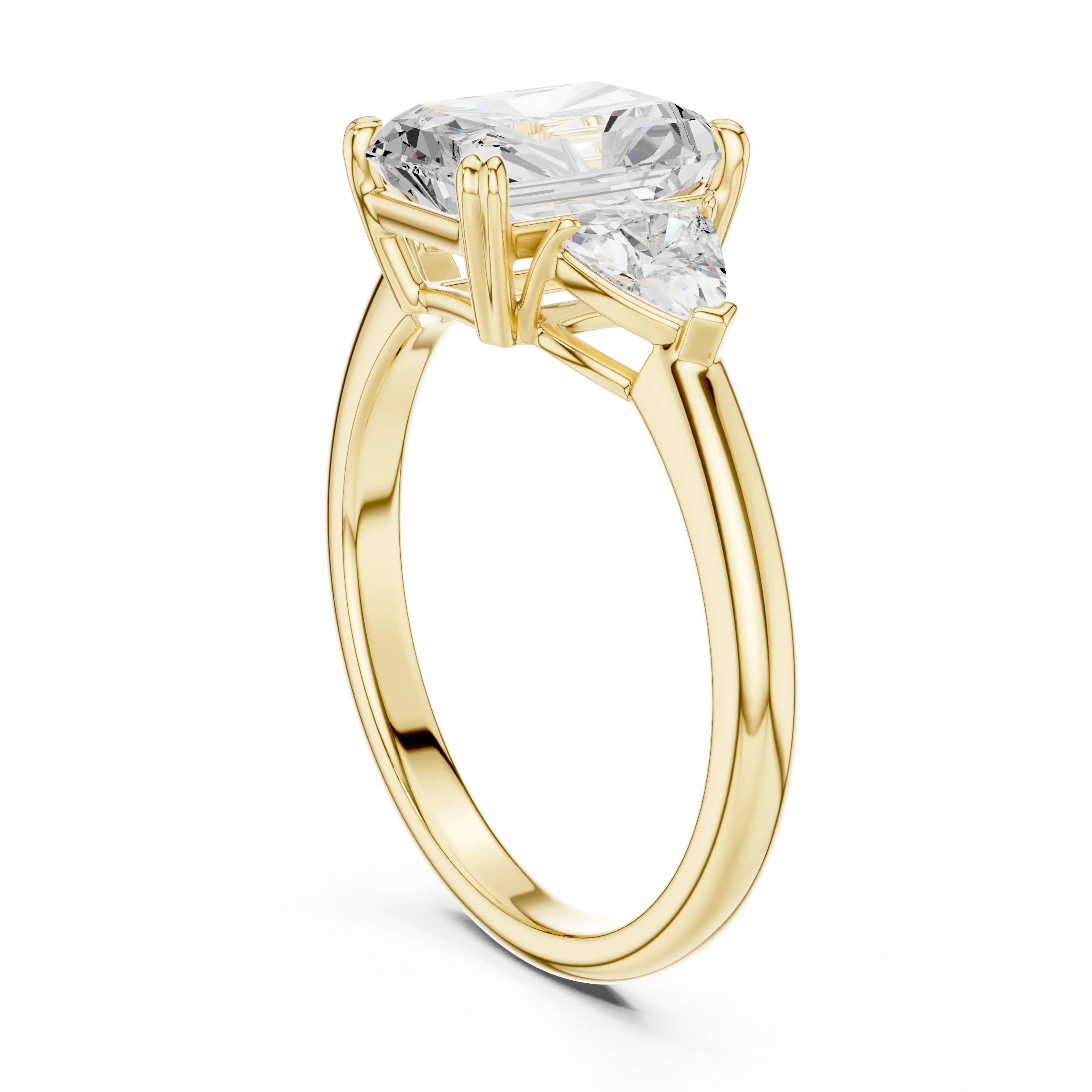 Back side view of yellow gold radiant three-stone ring with trillion cut side stones and lab-grown diamond – Australia