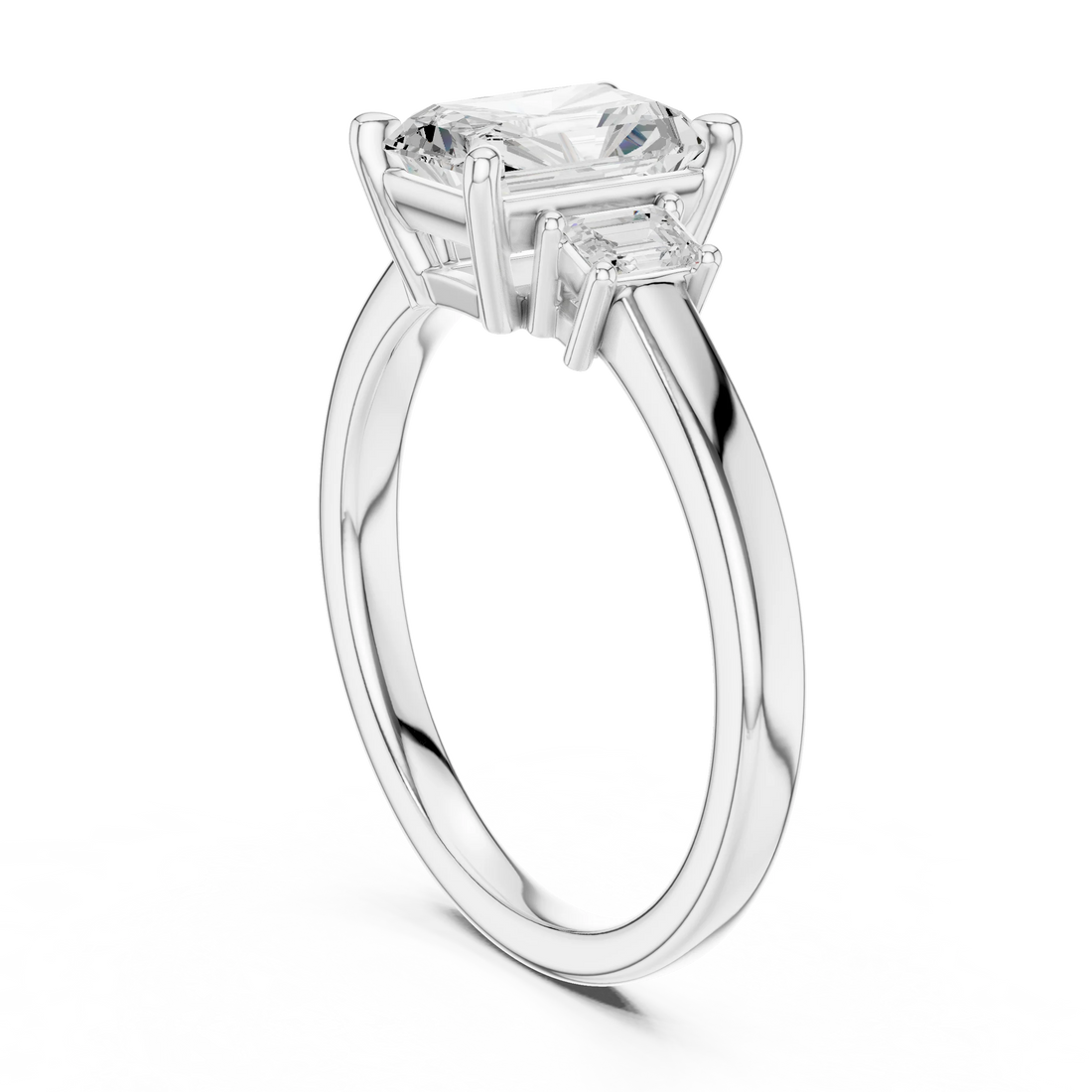 Radiant three stone engagement ring with emerald cut side stones in white gold, lab grown diamond, back view, Australia DFE