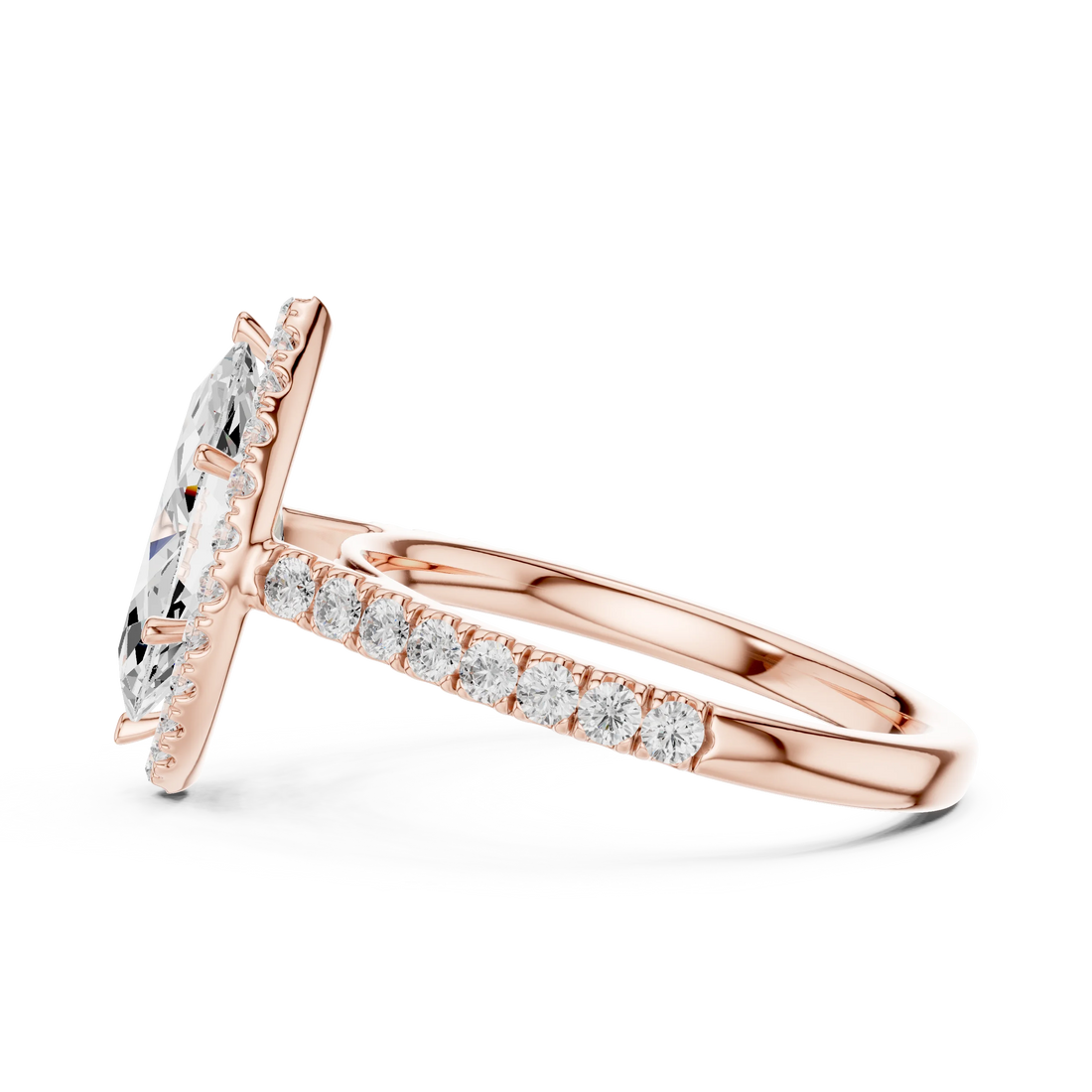 Side view of rose gold marquise cut diamond ring with regal halo setting highlighting elevated center stone and elegant band profile