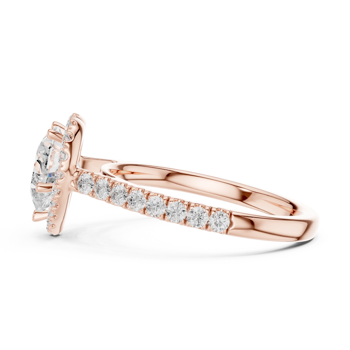 Side view of rose gold heart shaped diamond ring with romantic halo setting showcasing elegant band and elevated center stone
