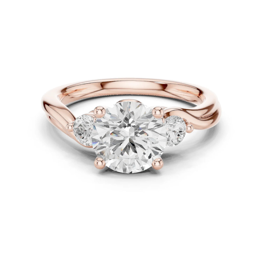 Round brilliant three stone ring with side diamonds on twisted vine shank in rose gold with modern romantic finish