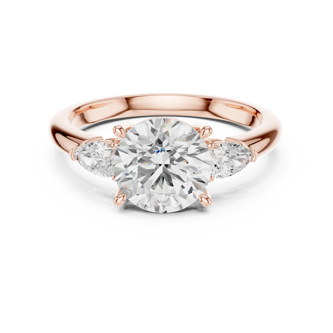Round three-stone ring in rose gold with pear side stones and lab-grown diamond – Australia