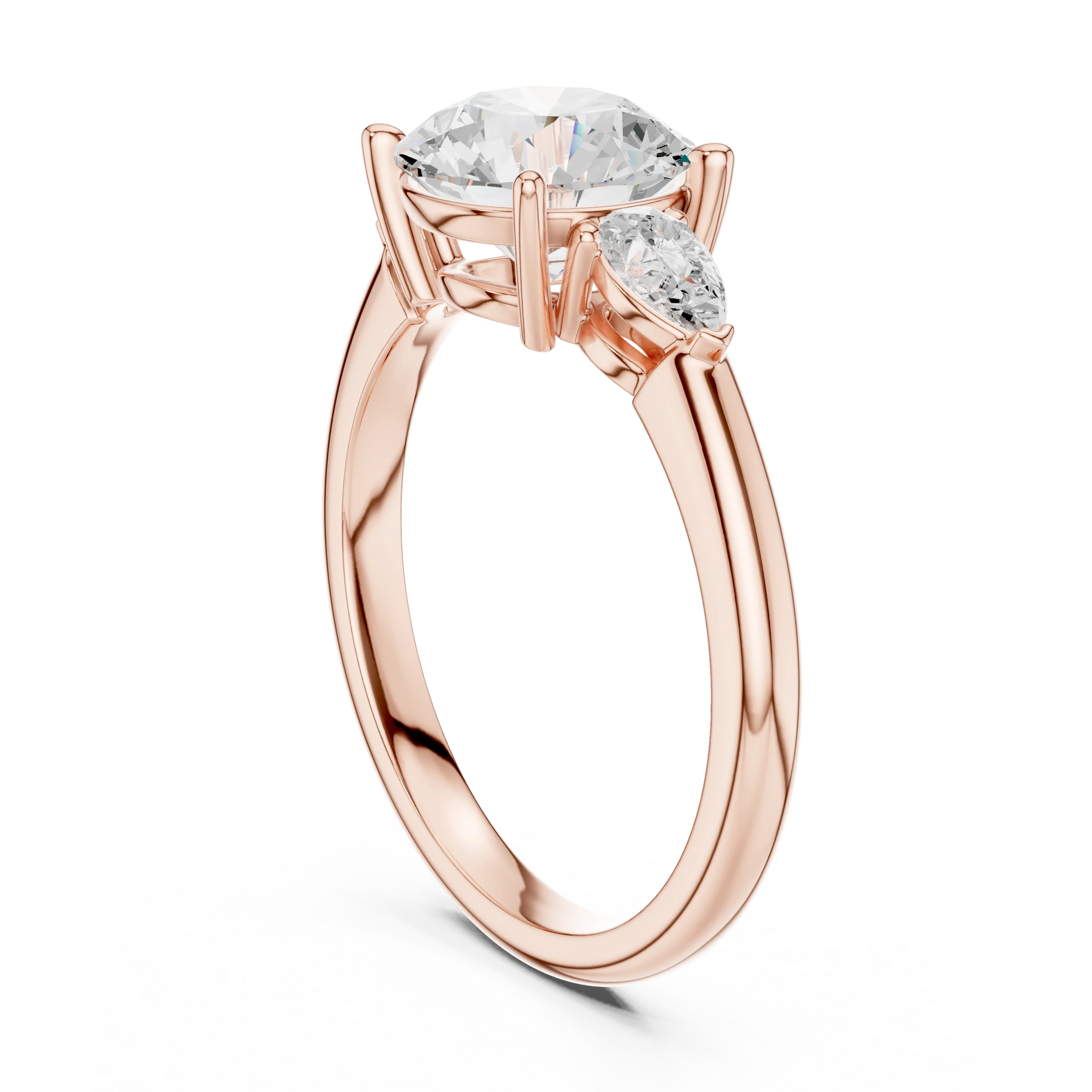 Back side view of rose gold round three-stone ring with pear side stones and lab-grown diamond – Australia