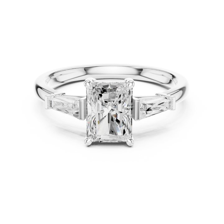 Lab-grown emerald center stone trinity ring with radiant side diamonds in white gold