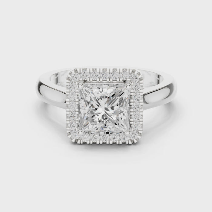 Video of white gold princess halo ring highlighting diamond setting and band profile