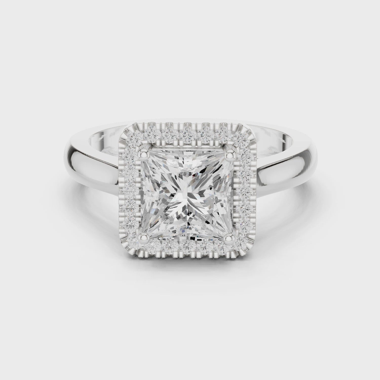 Video of white gold princess halo ring highlighting diamond setting and band profile