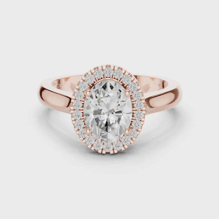 Video of rose gold oval halo ring highlighting diamond setting and band profile