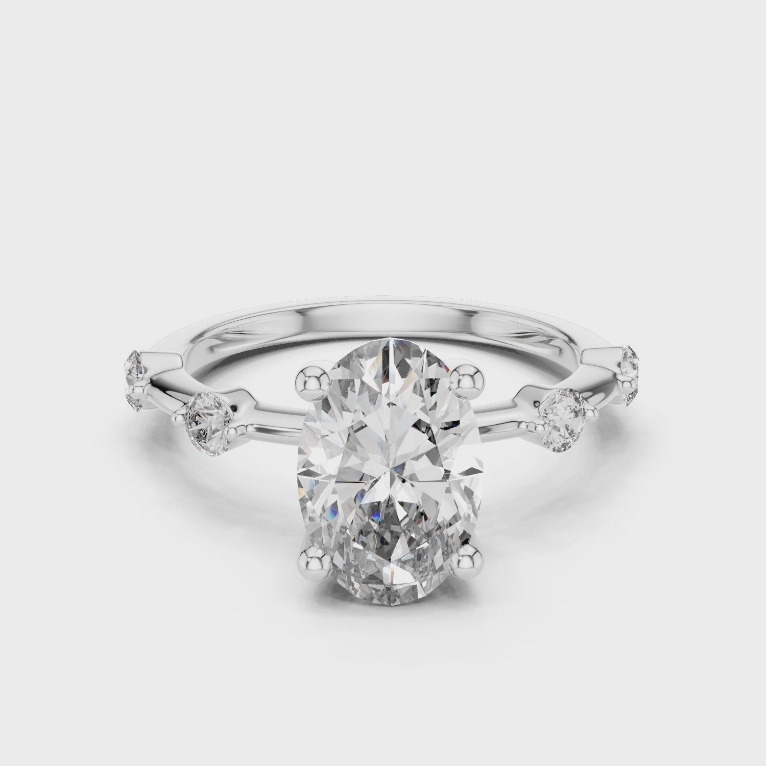 Oval Solitaire Diamond Ring with Round Side Accents